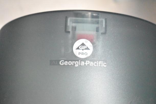 Georgia-Pacific GP Pro logo on a commercial paper towel dispenser, indicating brand and model.