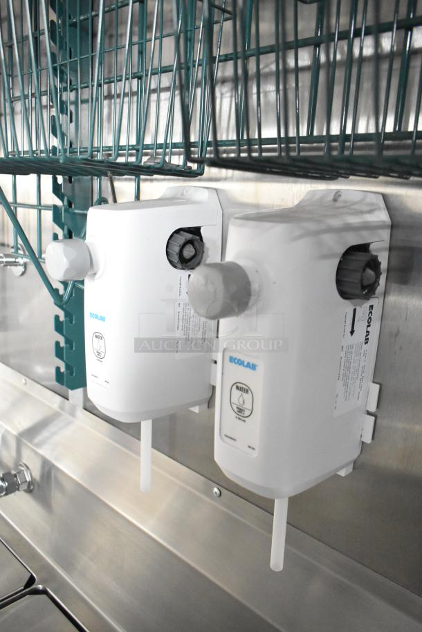 Rock Solid Cargo trailer interior showing Ecolab water dispensers mounted on a stainless steel wall.