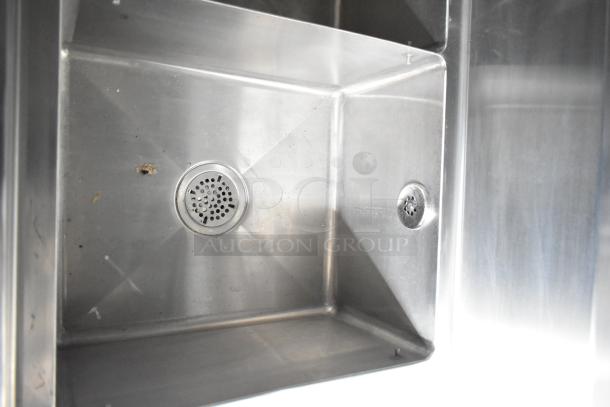 Stainless steel commercial sink inside Rock Solid Cargo 24' fast food trailer, featuring dual drains. Suitable for food operations.