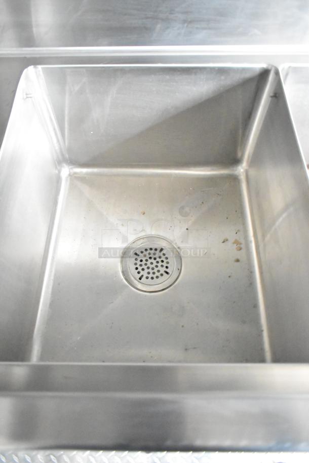 Commercial-grade stainless steel sink in a Rock Solid Cargo mobile kitchen trailer. Brand new condition.