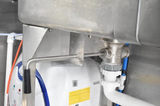 Stainless steel sink fixture inside a 2021 Rock Solid Cargo fast food trailer, brand new condition.