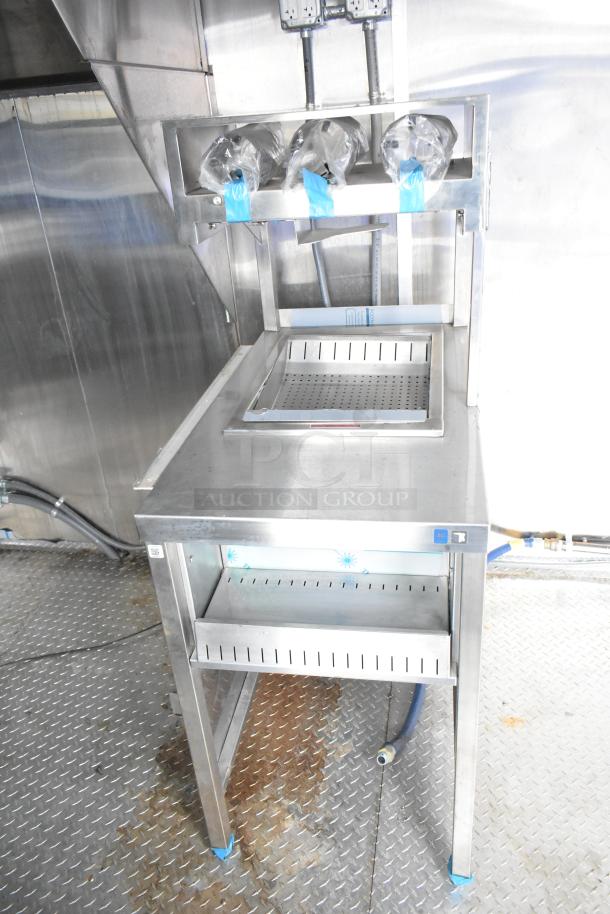 Brand new Rock Solid Cargo 24' mobile kitchen trailer, featuring stainless steel equipment, CaptiveAire grease hood, and sinks.