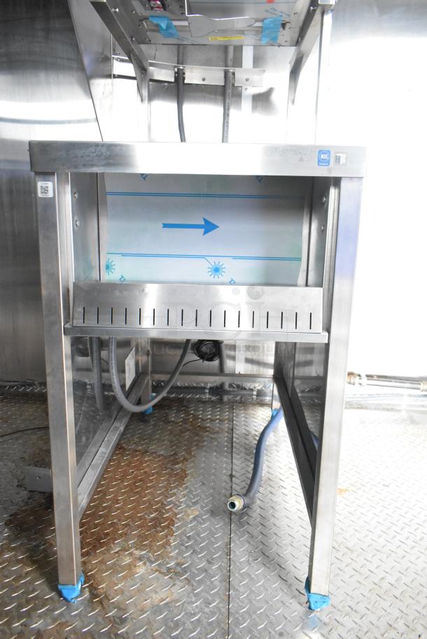 Brand new 24' Rock Solid Cargo fast food trailer interior, featuring CaptiveAire grease hood, commercial kitchen setup.