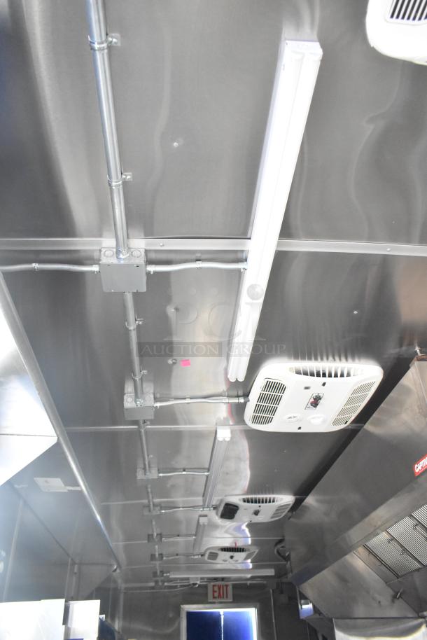 Brand new 2021 Rock Solid Cargo 24' fast food trailer interior. Features commercial-grade appliances, CaptiveAire grease hood.