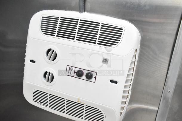 Interior view of 2021 Rock Solid Cargo mobile kitchen with a white wall-mounted ventilation control panel and adjustable vents.