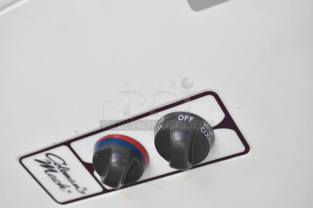 Close-up of Coleman-Mach control panel with temperature and fan settings, featuring "OFF" and "HIGH COOL" options.