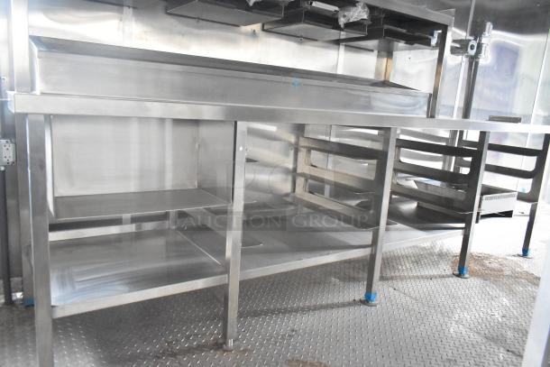 Brand new 2021 Rock Solid Cargo 24' mobile kitchen with commercial-grade stainless steel counters, fully equipped for fast food service.