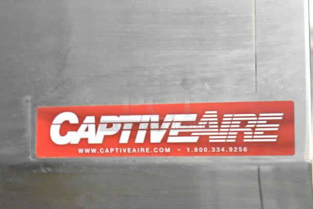 Alt text: CaptiveAire grease hood label inside Rock Solid Cargo fast food trailer.