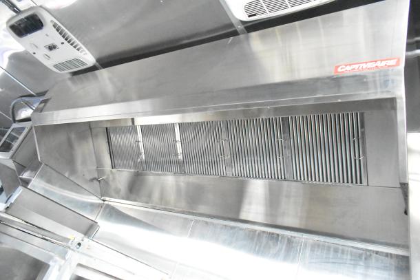 Rock Solid Cargo mobile kitchen trailer, featuring new CaptiveAire grease hood, stainless steel interior, and ventilation system.