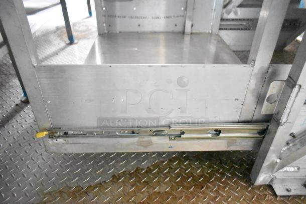 Rock Solid Cargo 24' fast food trailer interior, showcasing stainless steel surfaces and sturdy construction.