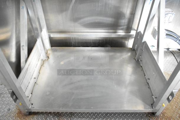 Interior view of a 2021 Rock Solid Cargo mobile kitchen trailer, featuring a metal frame and clean steel surfaces.