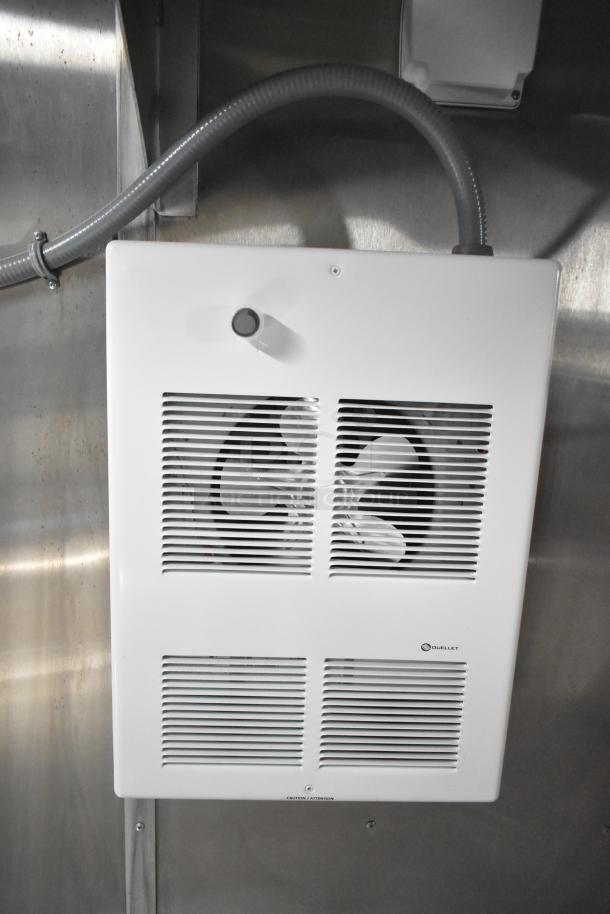 Ventilation fan inside 2021 Rock Solid Cargo 24' mobile kitchen trailer. Features Ouellet branding, pristine condition.