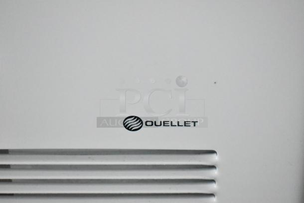 Ouellet logo on a white surface, possibly part of a commercial appliance in the Rock Solid Cargo trailer.