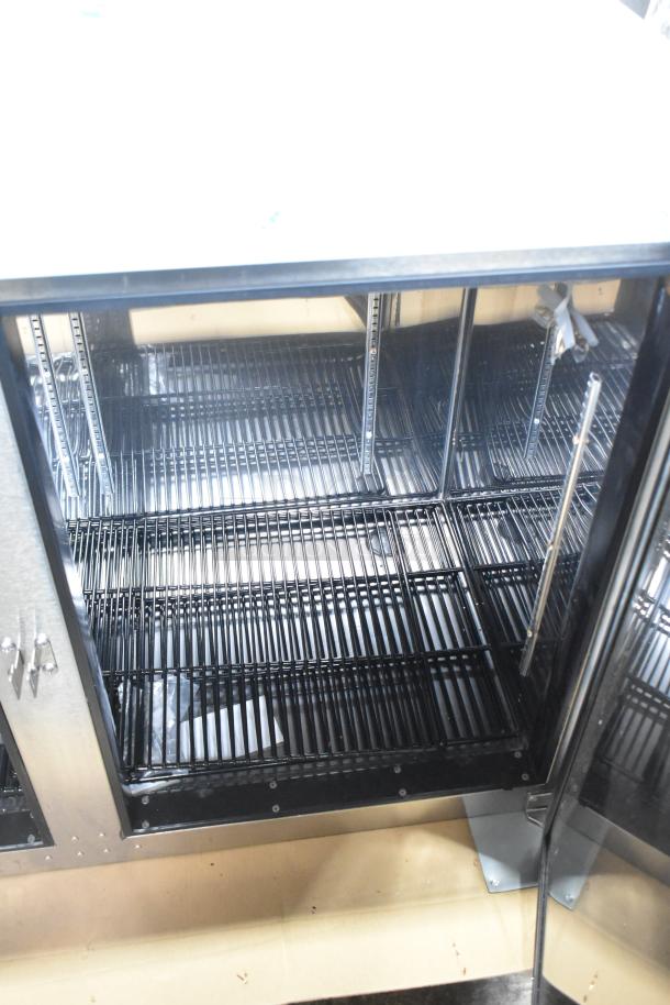 Brand new Perlick BBS60-RF-Y-S-X-H1 60" commercial black solid door back bar refrigerator, interior shelving shown.