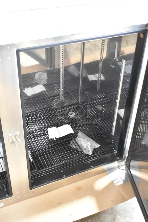 Brand new 2025 Perlick BBS60-RF-Y-S-X-H1 60" commercial back bar refrigerator, solid black door, interior view, minor scratches.