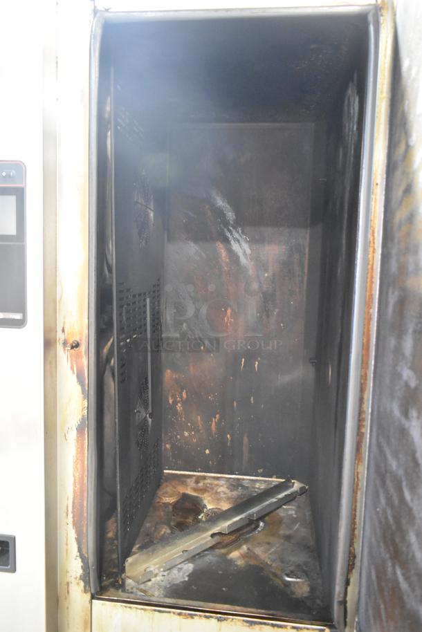 2023 Henny Penny FPGM22172007 combi convection oven interior. Natural gas, stained interior, 200,000 BTU. Roll-in rack.