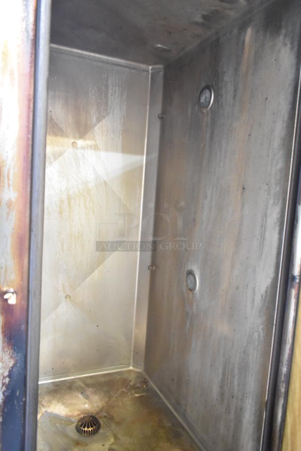 Interior of 2023 Henny Penny FPGM22172007 commercial gas convection oven, showing wear and stainless steel construction.