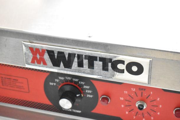 Wittco 1001 heated holding cabinet control panel, features adjustable temperature dial and settings, stainless steel, on commercial casters.