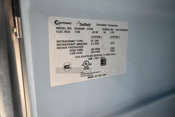2016 Delfield UC4048P-STAR commercial cooler label shows specs: 115V, R-290 refrigerant, NSF certified, made in USA.