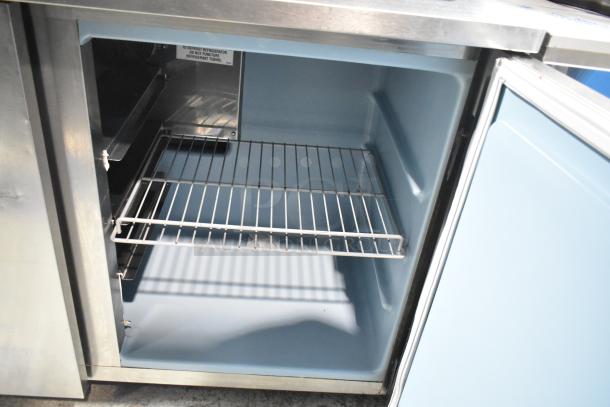 2016 Delfield UC4048P-STAR 2 Door Undercounter Cooler, 115V, 1 Phase. Features stainless steel exterior, wire shelves, and interior label.
