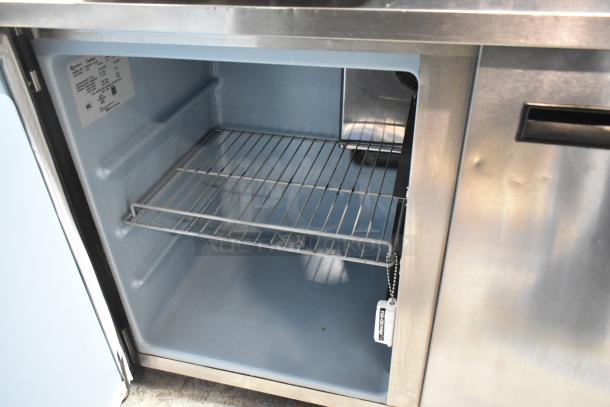 2016 Delfield UC4048P-STAR undercounter cooler, 2-door, 115V, 1-phase, stainless steel exterior, internal label visible.