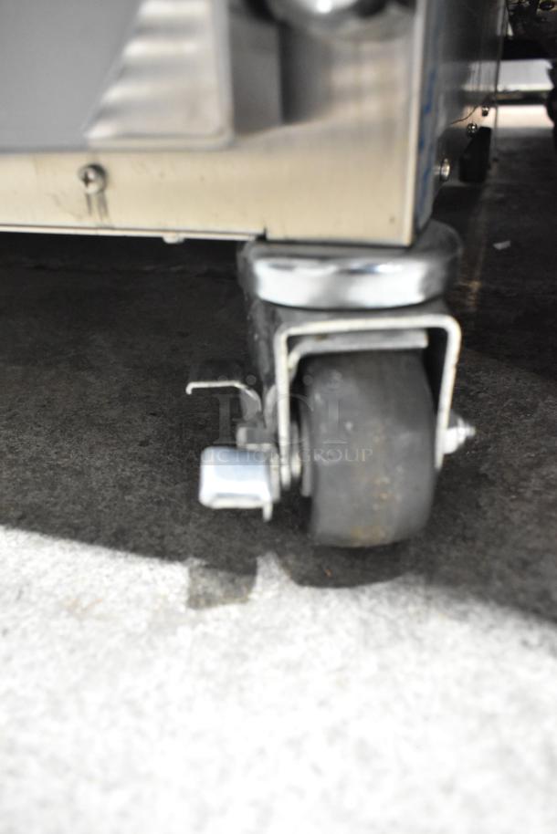 2023 Alto Shaam 750-TH/II cook and hold oven on sturdy commercial casters, 120V, 1 phase, features durable wheels.