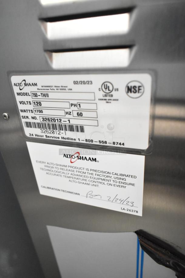 2023 Alto Shaam 750-TH/II Cook and Hold Oven, stainless steel, 120 volts, 1 phase, commercial casters, calibration label visible.