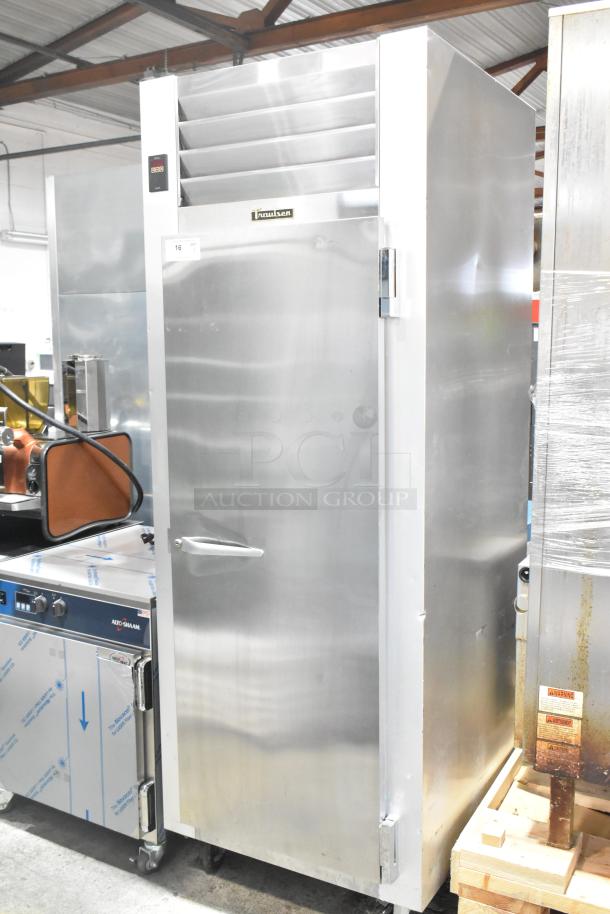 Traulsen G12010 commercial single door reach-in freezer on casters, stainless steel, 115V, good condition.
