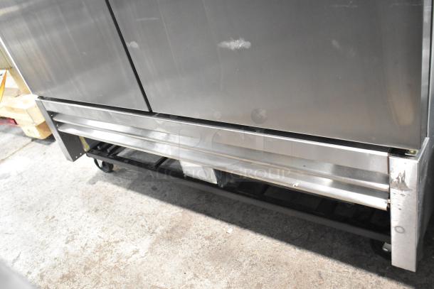 2019 True T-49F-HC Commercial 2 Door Reach-In Freezer on casters. Stainless steel, 115 volts, 1 phase. Minor wear visible.