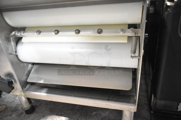 Somerset CDR-170 commercial dough sheeter, countertop model. Features white rollers, stainless steel, 110V, 1 phase. Excellent condition.