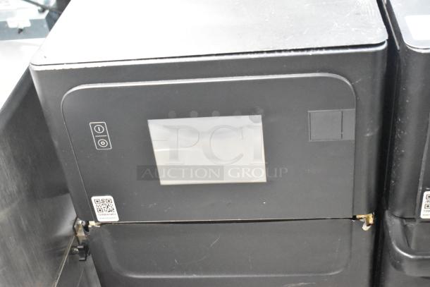 Merrychef eikon e2s high-speed countertop oven, black, touchscreen, 208/240V, 1 phase, with QR code for service.