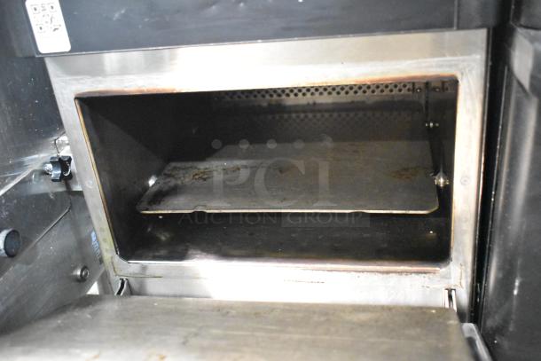 2022 Merrychef eikon e2s high-speed cooking oven, shows interior condition. 208/240V, 1 phase. Slight wear visible.