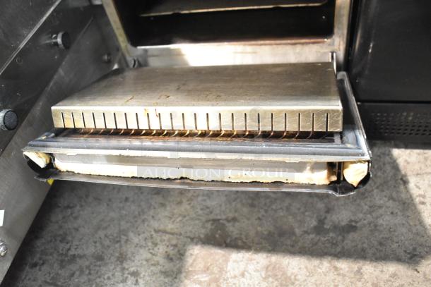 2022 Merrychef eikon e2s high-speed oven, 208/240V, 1 phase. Shown open, highlighting interior condition. Ideal for commercial use.