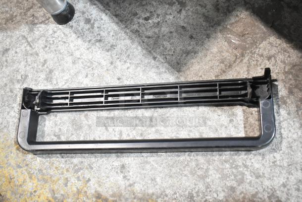 Black plastic vent panel for Merrychef eikon e2s oven. Features multiple slots and markings, indicating compatibility.