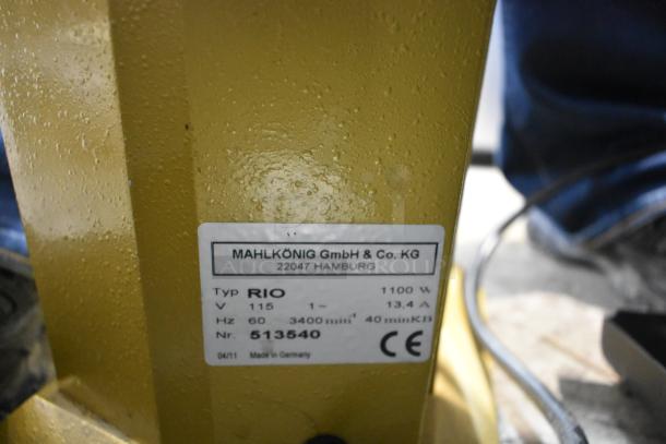 Mahlkonig RIO commercial bean grinder with label showing model RIO, 115V, 1 phase, 1100W, made in Germany.