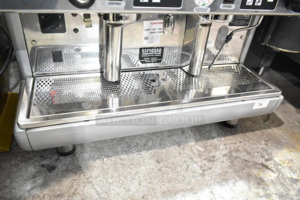 LavAzza commercial 2 group espresso machine, stainless steel, with steam wand. Visible labels indicate model and voltage.