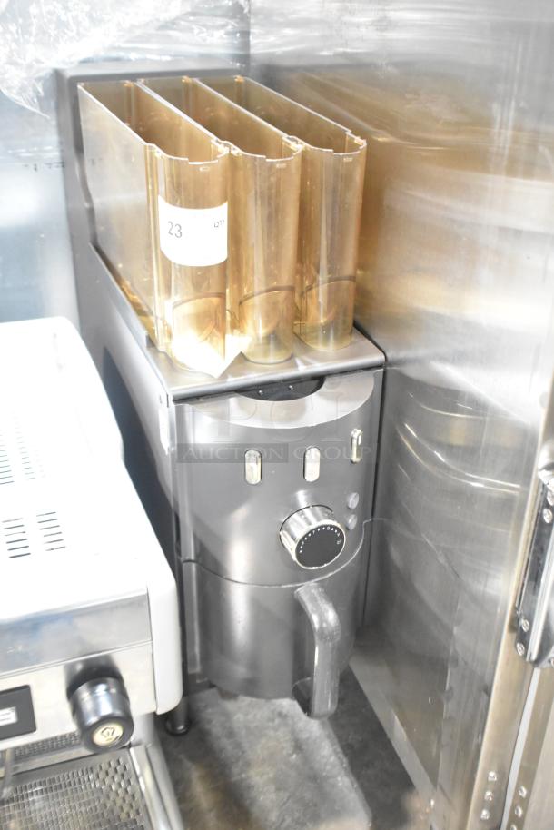 Commercial countertop coffee tower machine with three brown bean hoppers, control dial, and silver-gray finish, used condition.