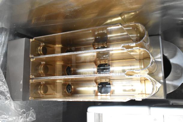 Commercial countertop coffee tower machine with clear compartments, sleek design, in excellent condition.