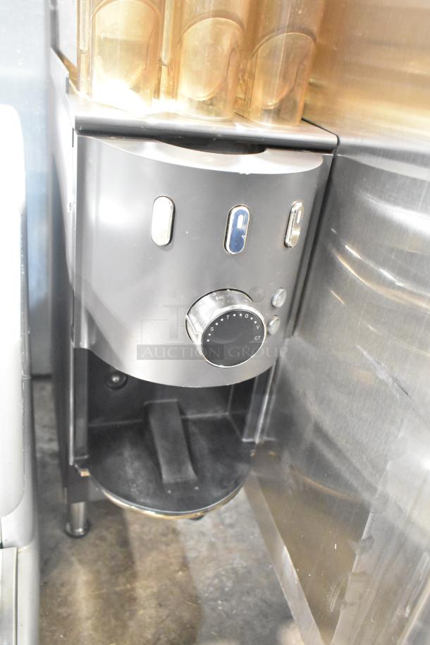 Commercial countertop coffee tower machine, stainless steel, dial controls, excellent condition, visible compartment layout.