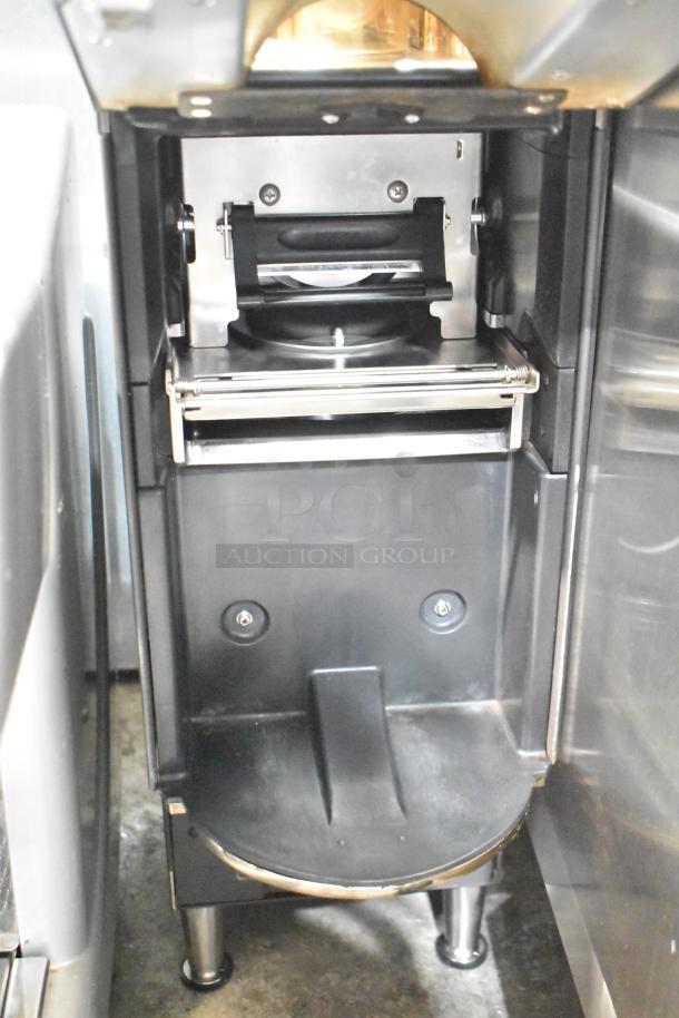 Commercial countertop coffee tower machine, sleek design, stainless steel finish, excellent condition, for efficient brewing.