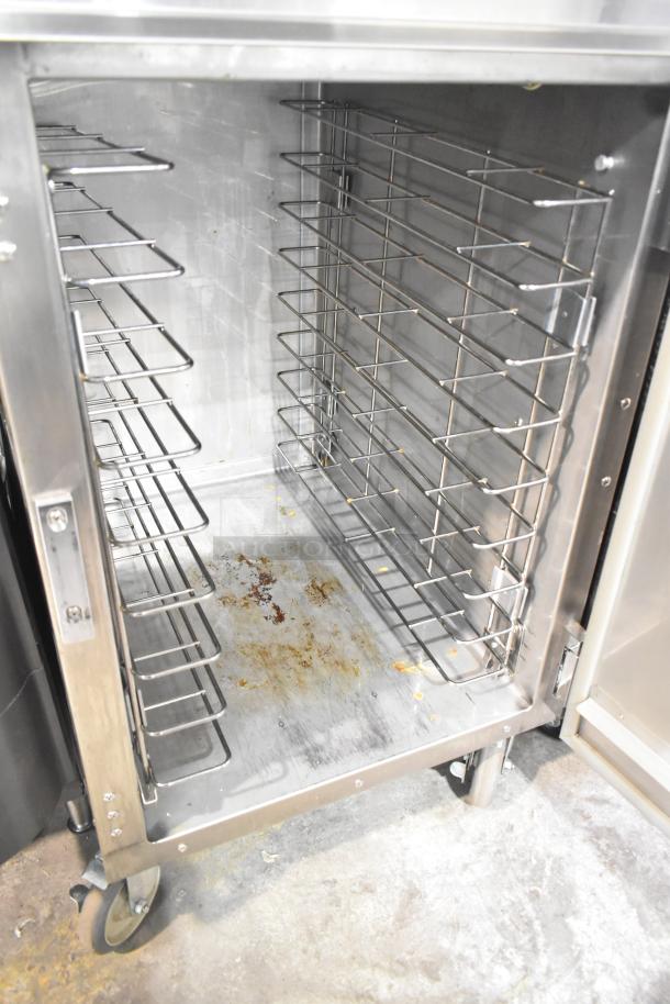 CresCor 1000HHSS2DX heated holding cabinet, stainless steel, on casters. Used condition, interior racks visible, 120V, 1 phase.