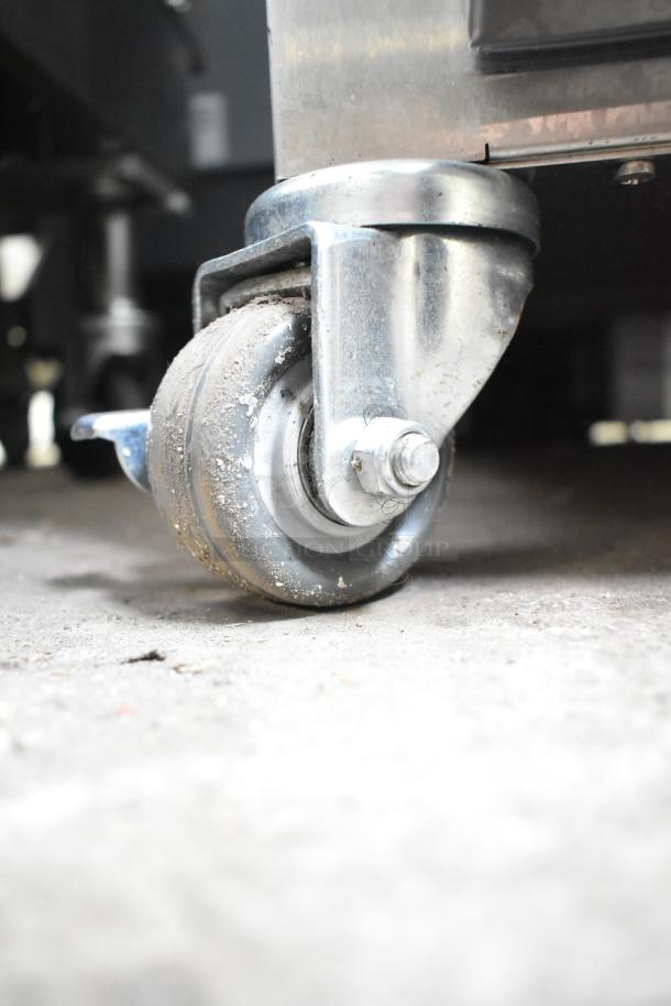 2024 Alto Shaam 750-S heated holding cabinet caster. Durable, commercial grade, showing moderate wear.