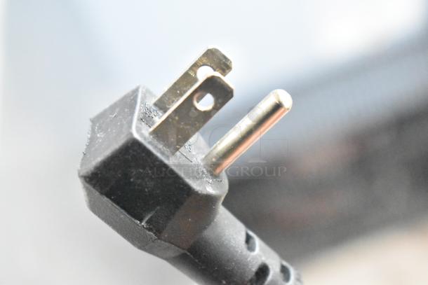 Close-up of a three-prong plug for the 2024 Alto Shaam 750-S Commercial Heated Holding Cabinet, 120 Volts, 1 Phase.
