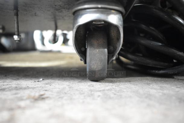 2019 Jun-Air 87R-4MN1-HSBHH stainless steel nitrogen generator on commercial caster, shows base and wheel detail.