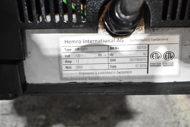 2019 Ditting KR1203 coffee grinder plate showing voltage, wattage, and serial number, engineered in Switzerland.