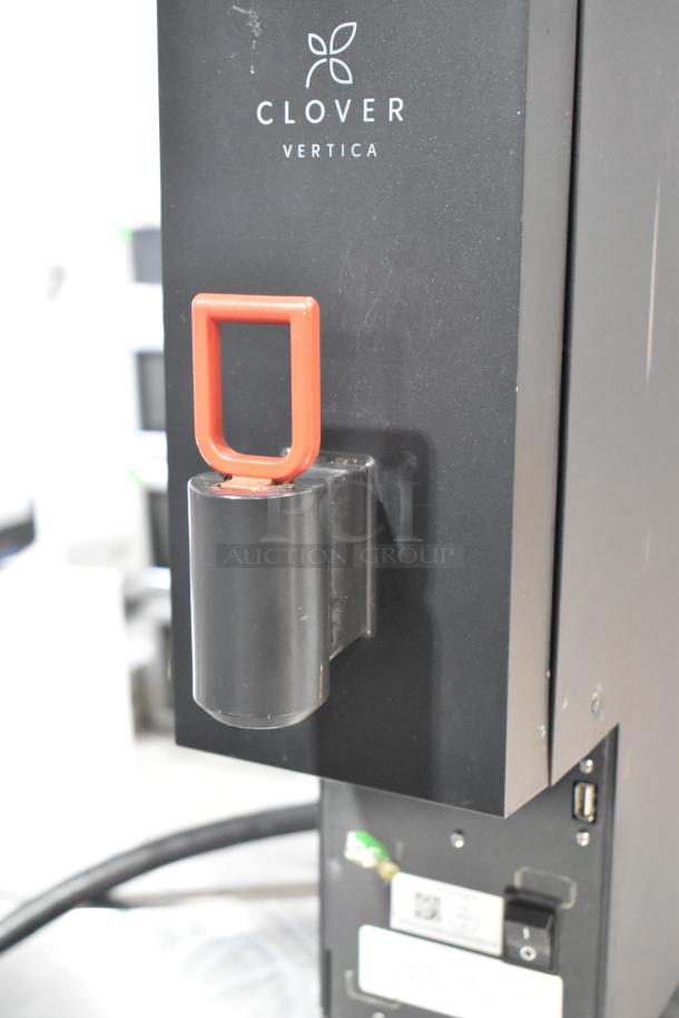 Clover Vertica CM9700 commercial water boiler, 208V, 1 phase. Features durable black finish, front red handle. Model CM9700.