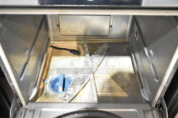 2024 Hobart LXNR stainless steel commercial undercounter dishwasher interior, showing spray arms and drainage area.