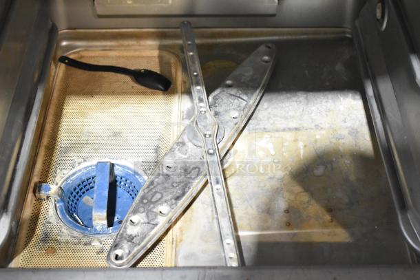 2024 Hobart LXNR Stainless Steel Undercounter Dishwasher interior. Features spray arm and filter; commercial quality.