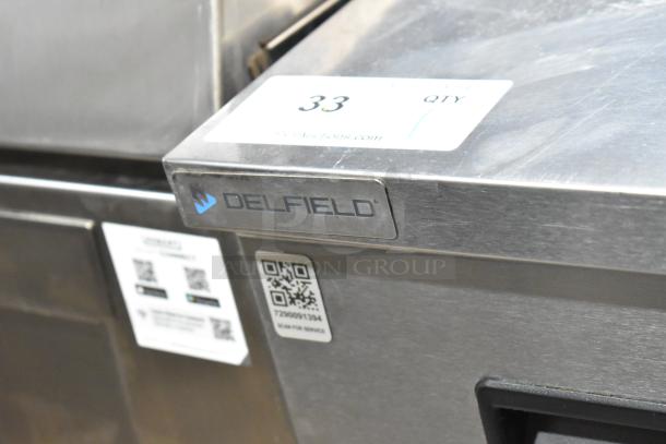 2022 Delfield 406P-STAR2 undercounter cooler with manufacturer label, casters, and QR code for service. 115 volts, 1 phase.