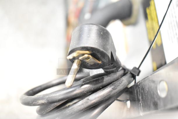 2019 Delfield 406P-STAR2 commercial cooler power plug, 115V, 1 phase. Coiled black cable, light dust visible.